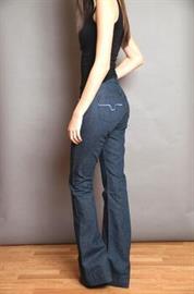 Mid-rise, trouser fit with wide flared cuffs. Crafted from dark wash tri-blend denim.