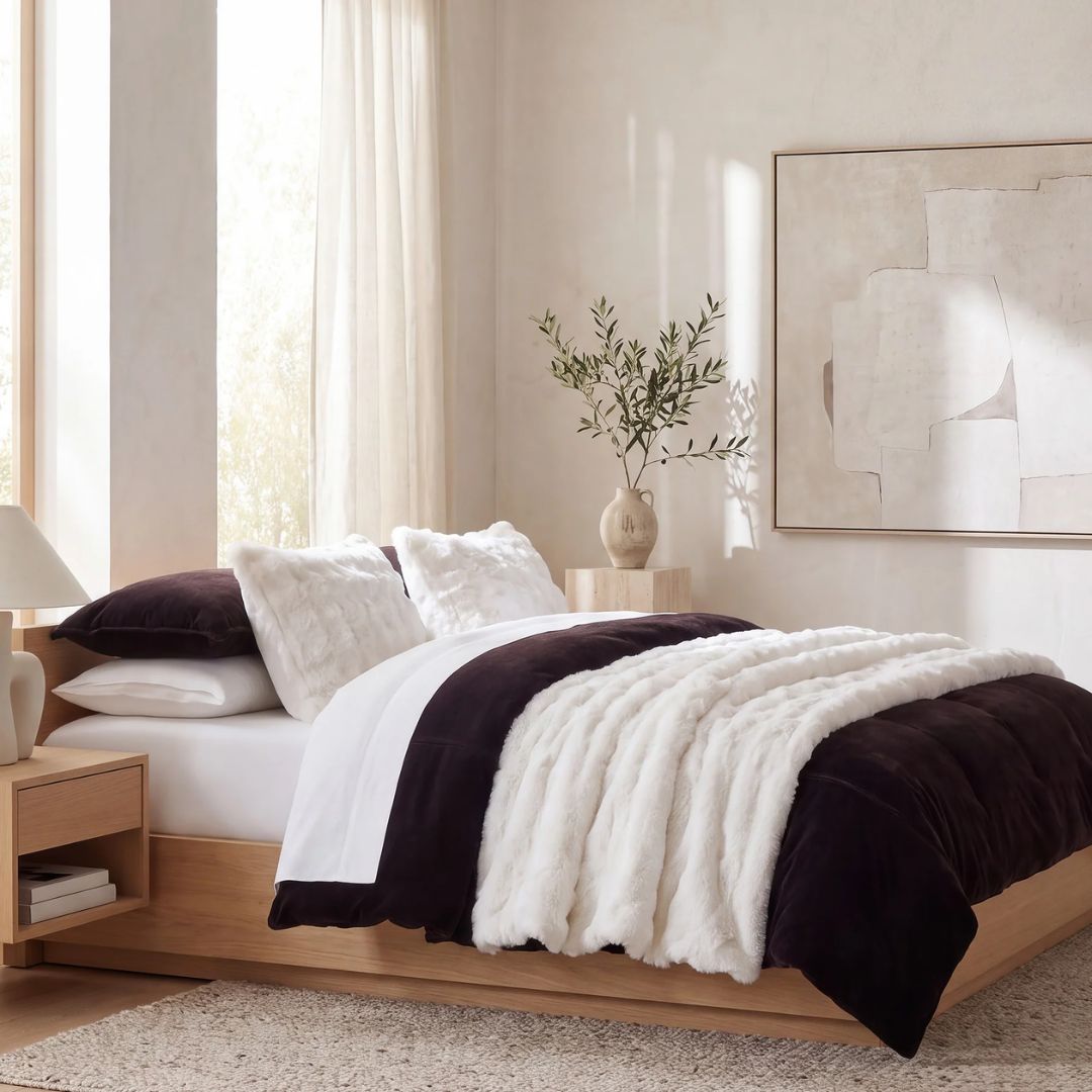 Warm without any heft, the comforter and matching shams layer cozy softness over any bed while a quiet, tonal richness does the work for you.