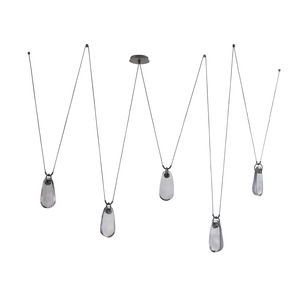 Dripping gracefully from bronze-plated iron supports and black fabric cords, this fixture creates a striking sense of motion enhanced by their flexible structure. 
