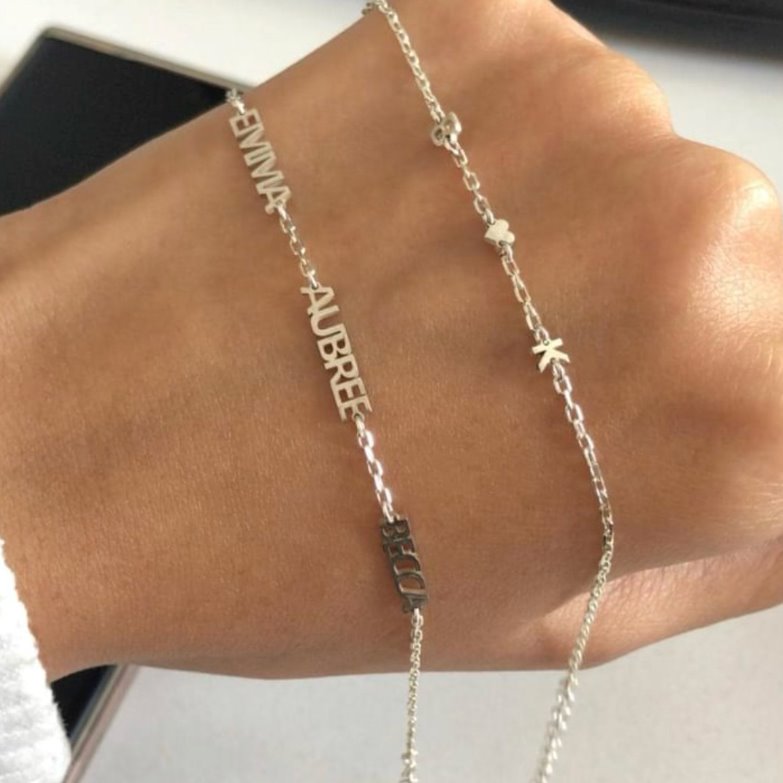 Our beloved multiple name bracelet returns in our favorite water resistant finish. Made-to-Order with one to three names. 