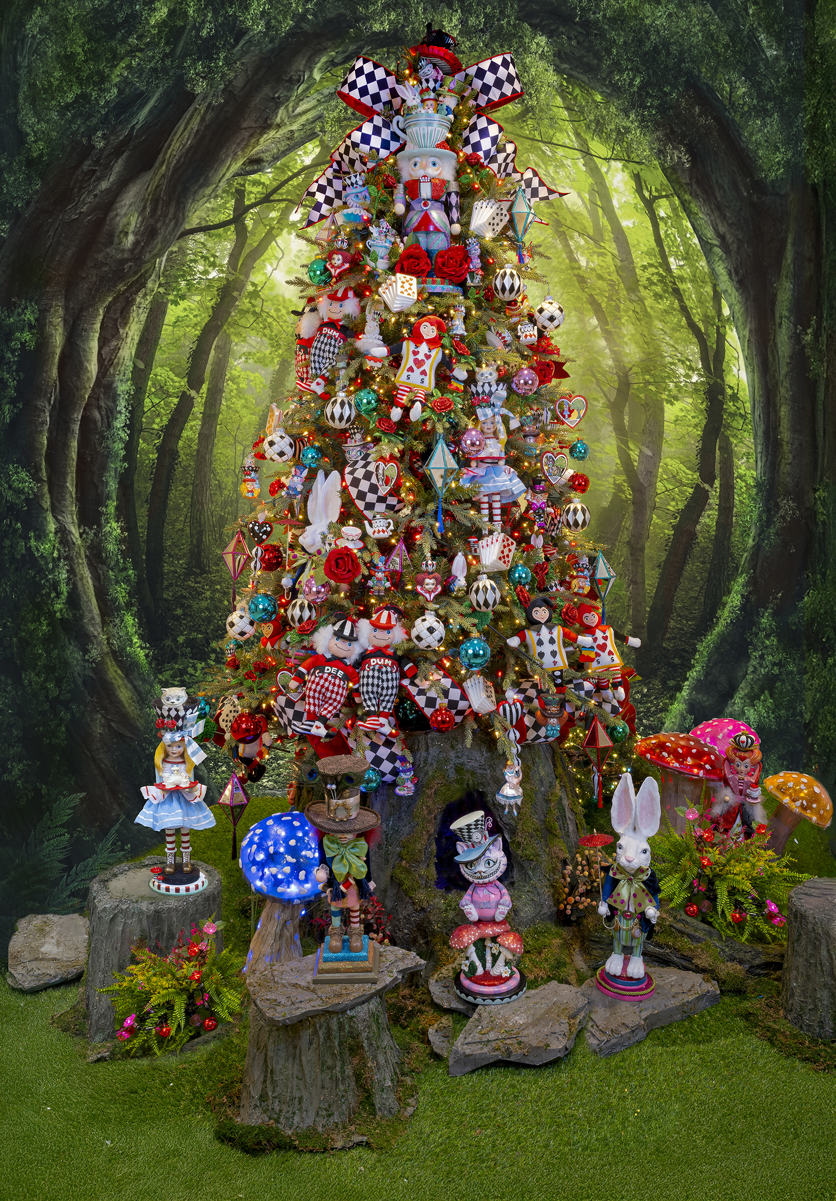 A tree decorated with Alice in Wonderland style is whimsical, enchanting, and full of storybook charm