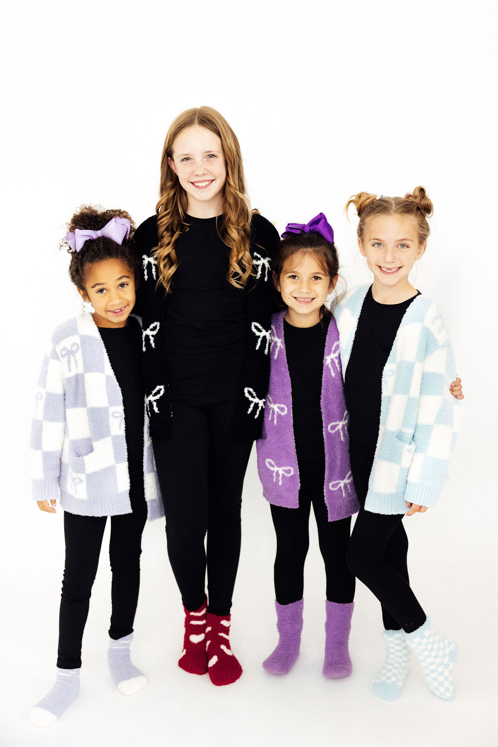 Our cozy collection- soft, snuggly, and perfect for cuddles or chilly day adventures! Featuring a soft cardigan, fluffy socks, cozy beanie, and a snuggly blanket.