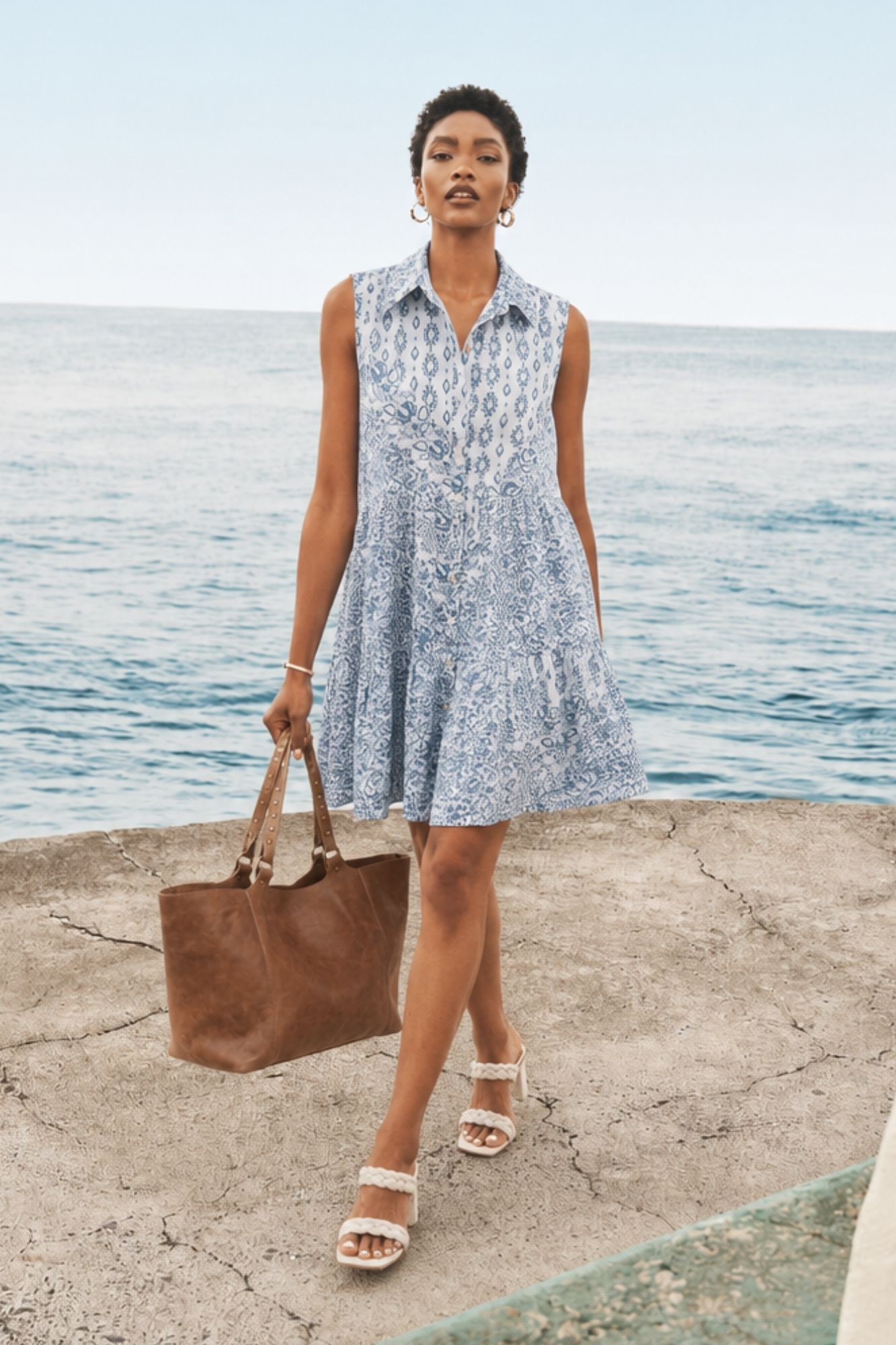 Breezy and beautifully printed, the Rosie Dress features a flowy silhouette and lightweight fabric for an effortlessly polished look from brunch to beach days.