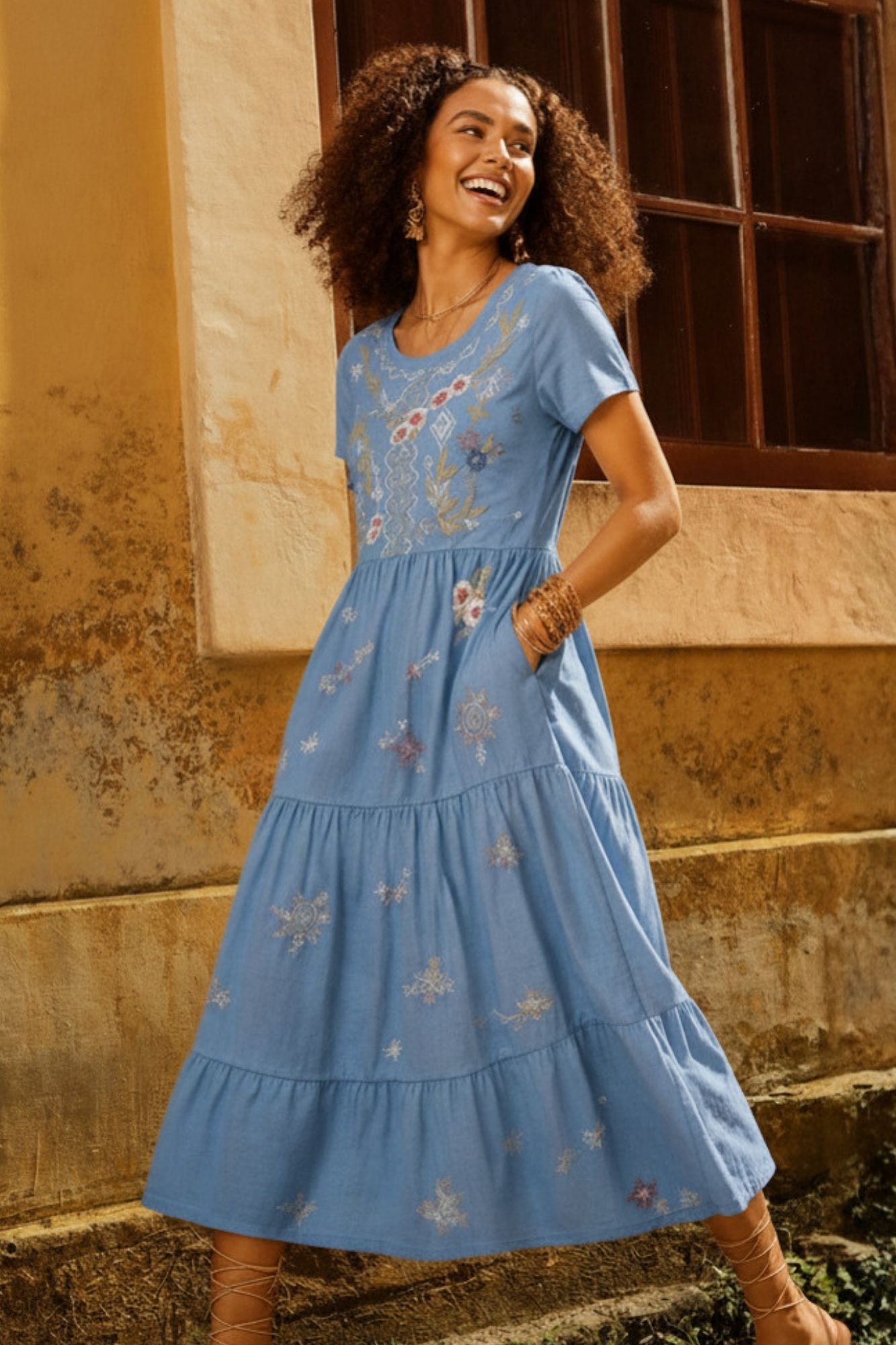 Beautifully embroidered with celestial-inspired details, the Sol Dress features a flowing tiered silhouette and soft cotton for an effortlessly feminine look.