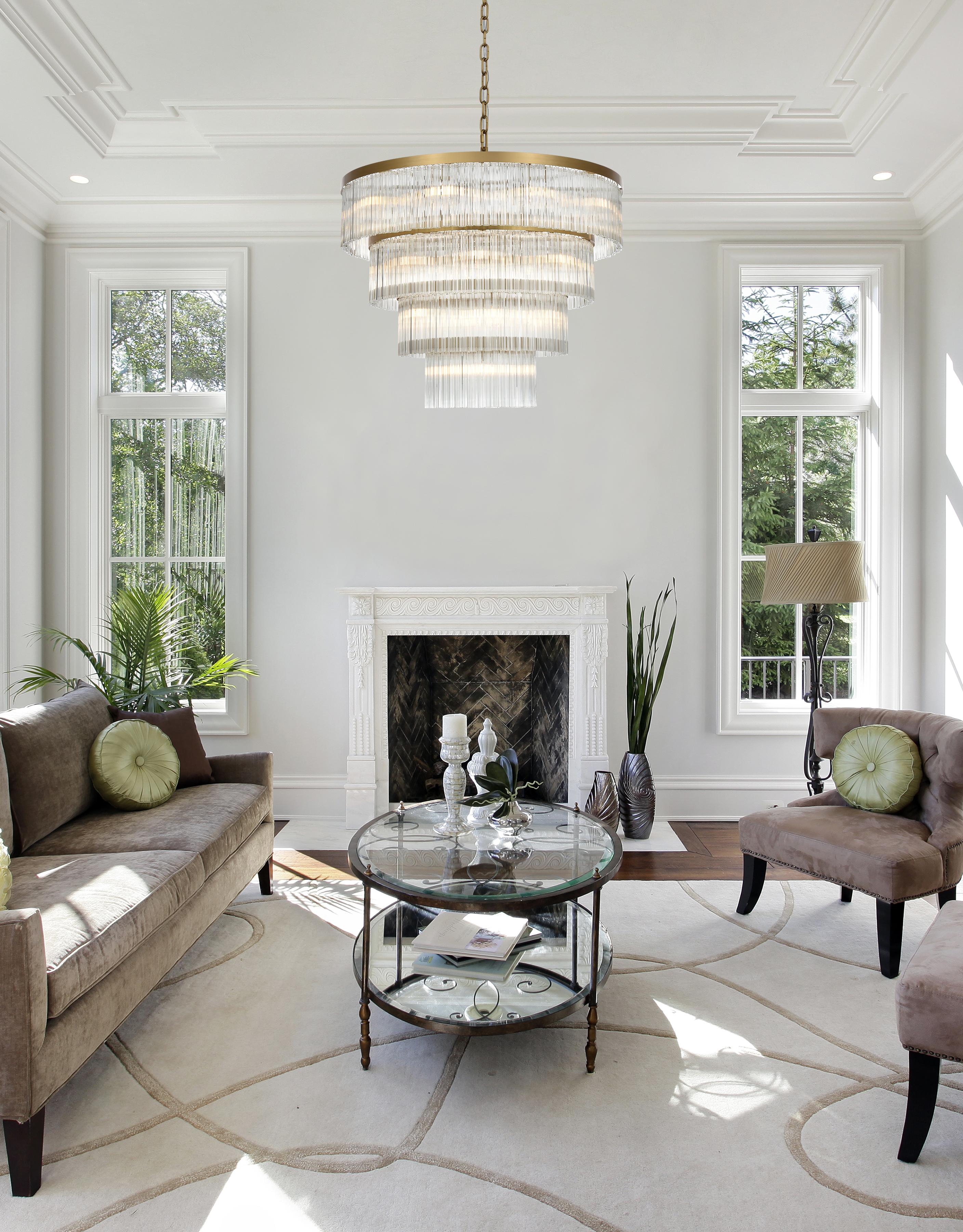 4 tier chandelier featuring glass rods set on a satin gold frame