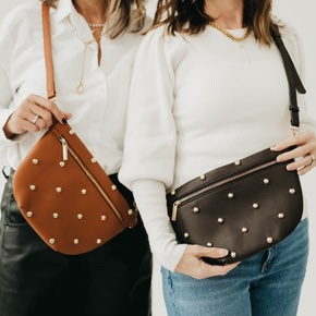 Keep your essentials close with the Chic Gold Studded Westlyn Bum Bag—a hands-free vegan-leather must-have available in four colors, adorned with bold gold studs for effortless, edgy style.