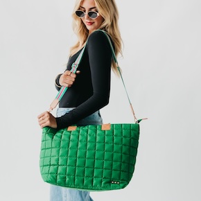 The Day Dreamer Quilted Tote Bag is a versatile everyday essential with smart organization, a trolley sleeve for easy travel, and colorful accent straps for a stylish touch.