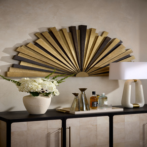 The radial patterns of the Art Deco and Hollywood Regency periods informed our oversized bronze brass clad sunburst.