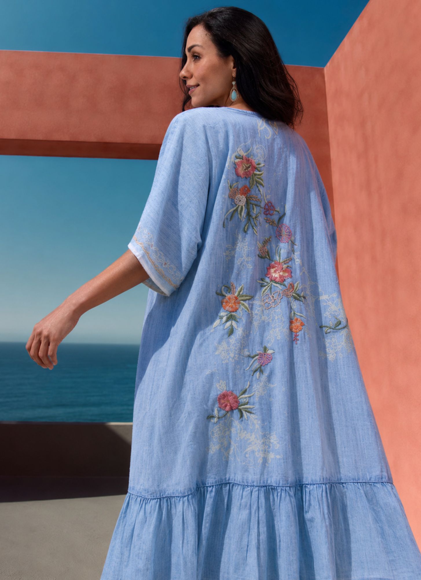 A flowing  kimono adorned with beautiful floral embroidery, designed to bring effortless elegance to every outfit.