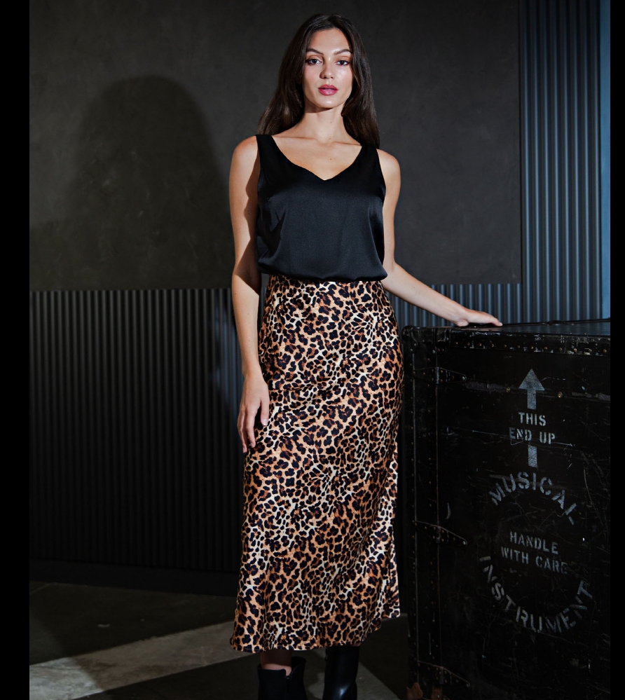 Leopard print midi skirt with a sleek, flattering silhouette, designed to add a bold yet versatile statement to modern boutique wardrobes