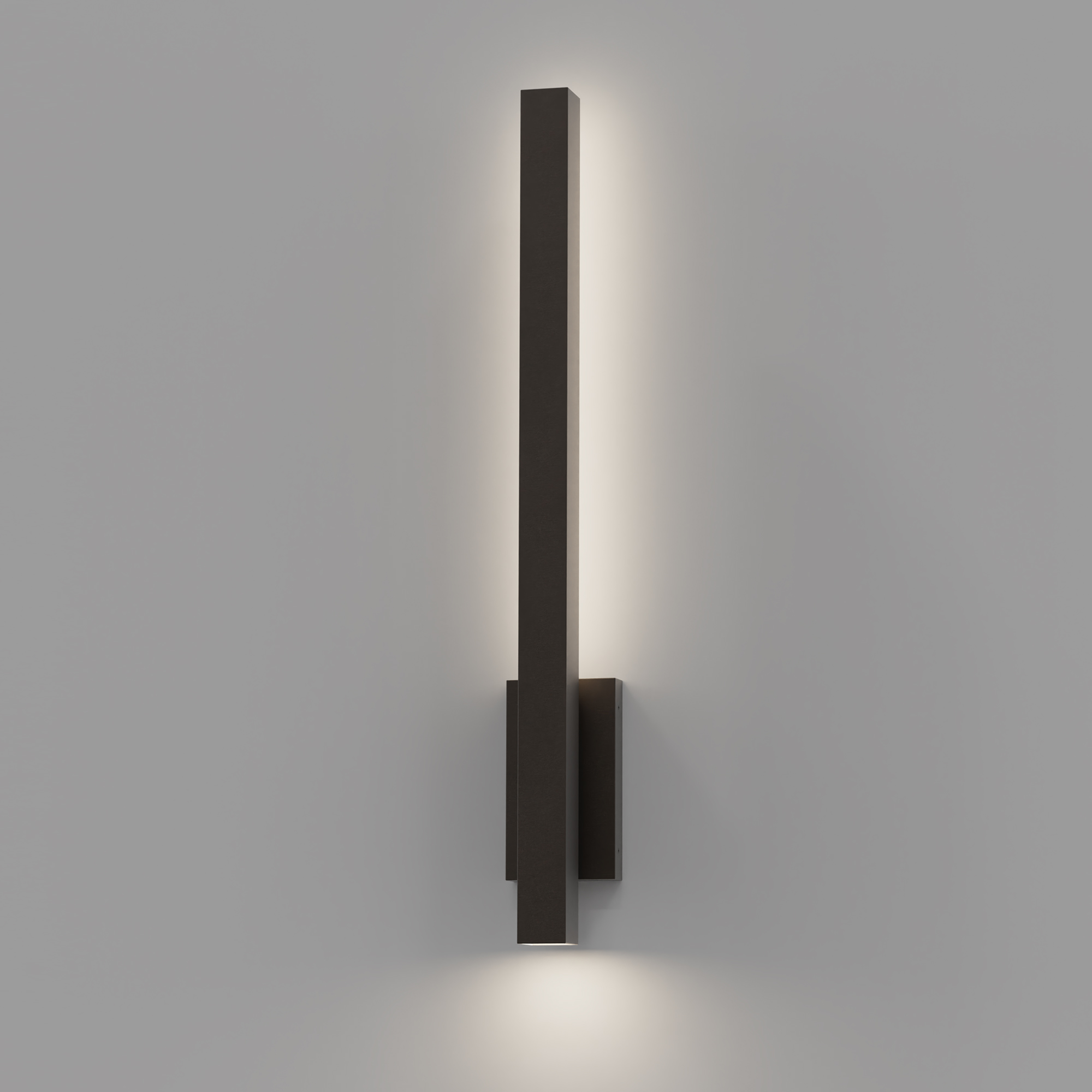The Lina Wall Sconce features solid brass construction, pairing a backlit design with a focused downlight to create a refined blend of modern innovation and timeless appeal.