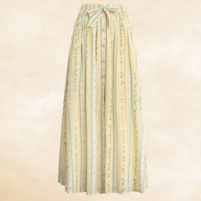 This skirt features decorative buttons, a tie-front, and a smocked waistband for a relaxed, easygoing silhouette perfect for everyday style.