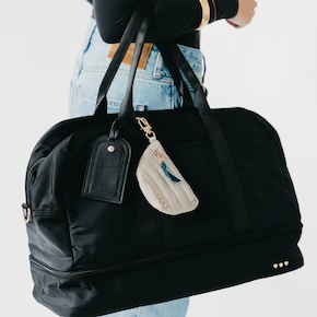The Nissa Nylon Weekender Bag is a lightweight, durable, and stylish travel essential with multiple pockets and a shoe compartment. 