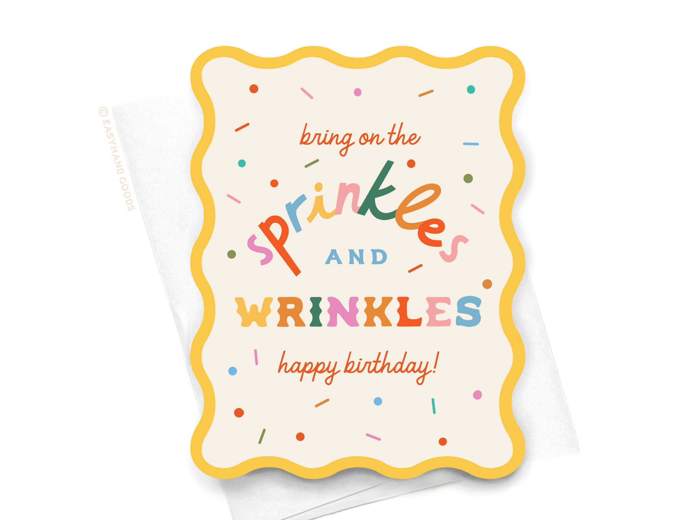 Brightly colored wavy die cut notecard that says "Bring on the Sprinkles & Wrinkles"