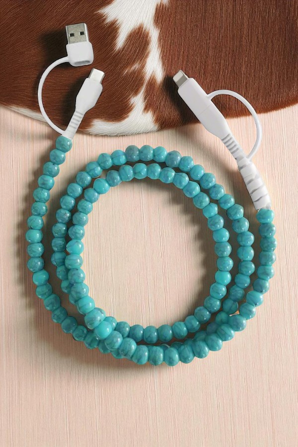Add a bold splash of style to your tech with our Turquoise Beaded Phone Charging Cord. Designed to stand out, this vibrant cable combines eye-catching turquoise beads with everyday functionality.
