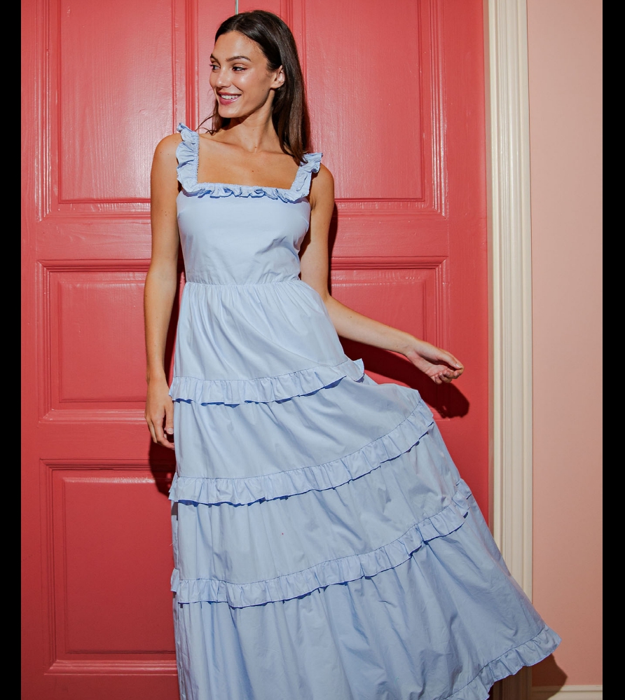 Light blue tiered maxi dress featuring ruffle shoulder straps and a softly gathered silhouette, designed for effortless movement and feminine boutique appea