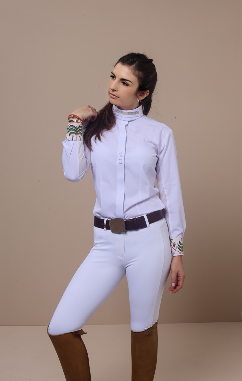 An ultra-lightweight, breathable show shirt with mesh ventilation and signature African-inspired details inside the collar and cuffs. For dressage and hunter/jumper riders.