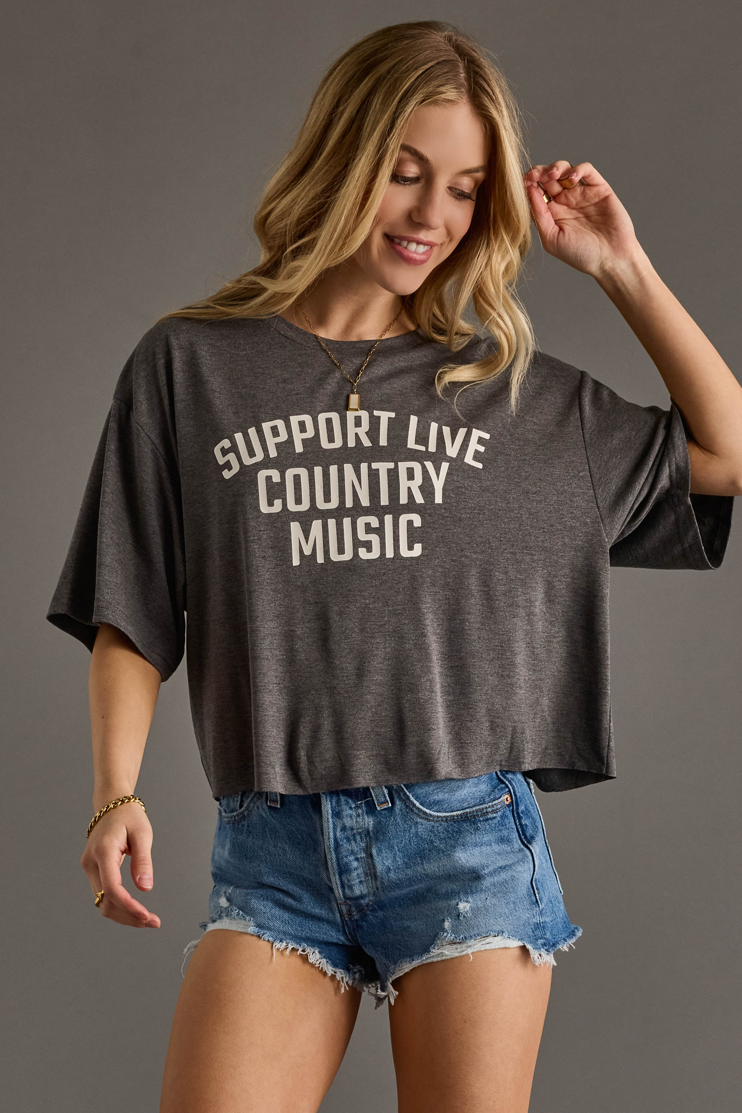 Charcoal Cropped Graphic Tee  White “Support Live Country Music” text on the front  Soft cotton-blend fabric, relaxed fit  Crew neckline, short sleeves  95% Cotton, 5% Spandex  Pre-pack 2-2-2-2 (S-XL)