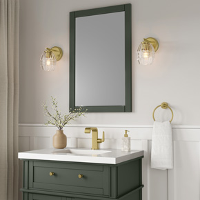 Barrel-shaped glass shades with horizontal ribbing create an attractive play of light in the Miravelle Collection of vanity and bath lighting.