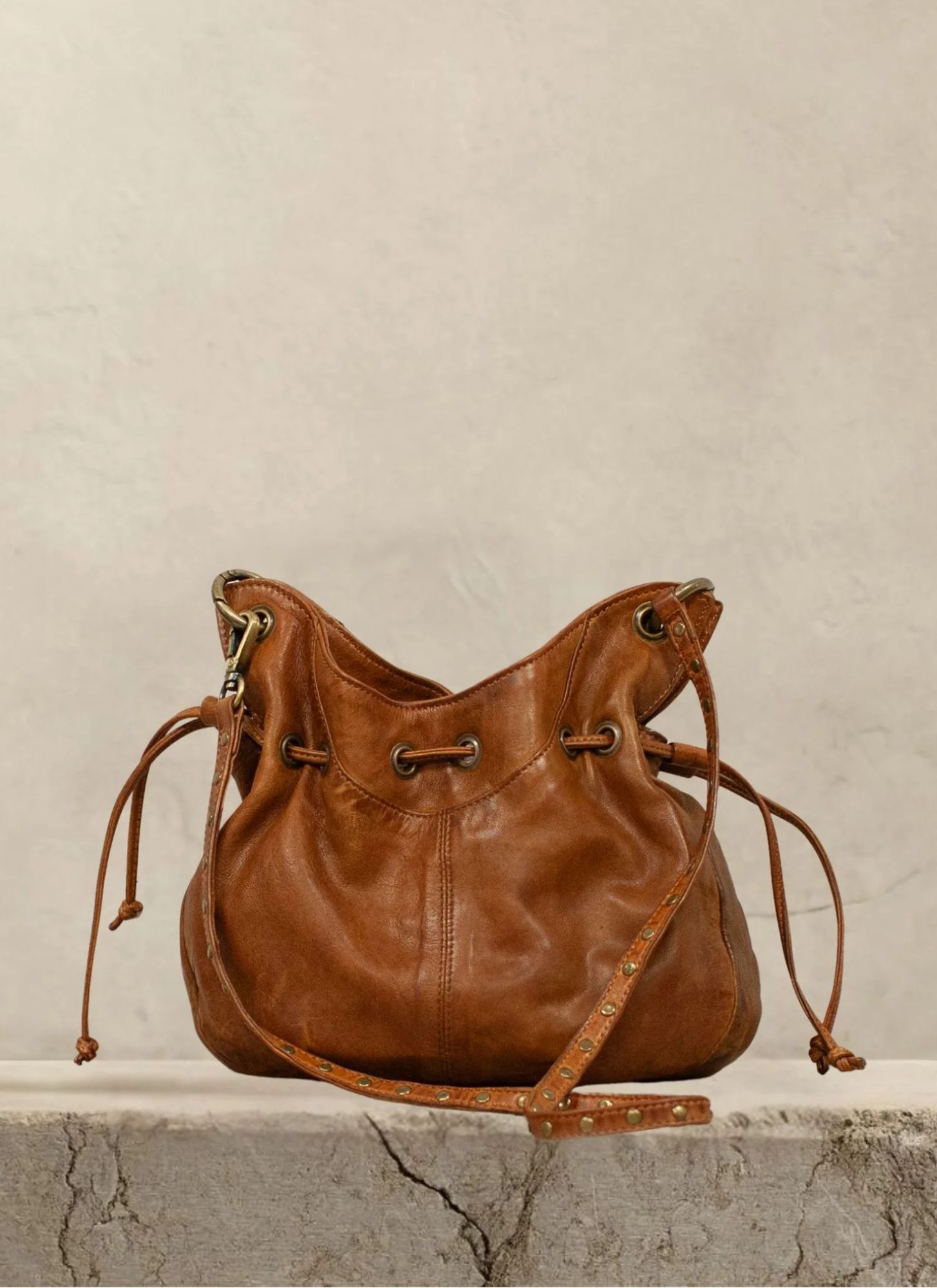 The Sheridan Bag is crafted from buttery-soft genuine leather with a relaxed, slouchy silhouette that effortlessly blends timeless style with everyday function.