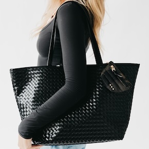 The Woven Tiffany Organized Tote Bag, made from high-quality vegan leather, features multiple interior pockets, a key leash, a laptop sleeve, and more!
